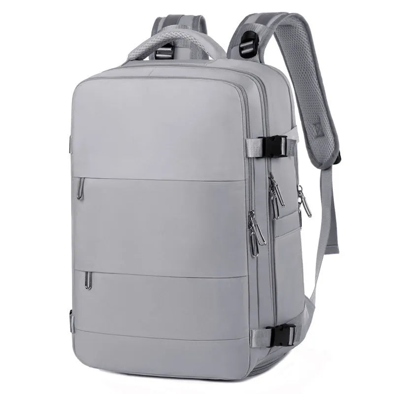 Large purple travel backpack with multiple compartments shown open to reveal organisational pockets