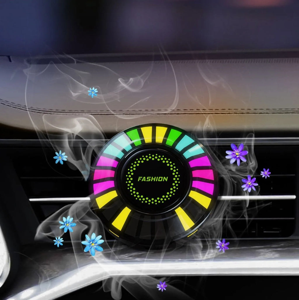 Car air vent aromatherapy diffuser with multicolour RGB lighting mounted in vehicle vent