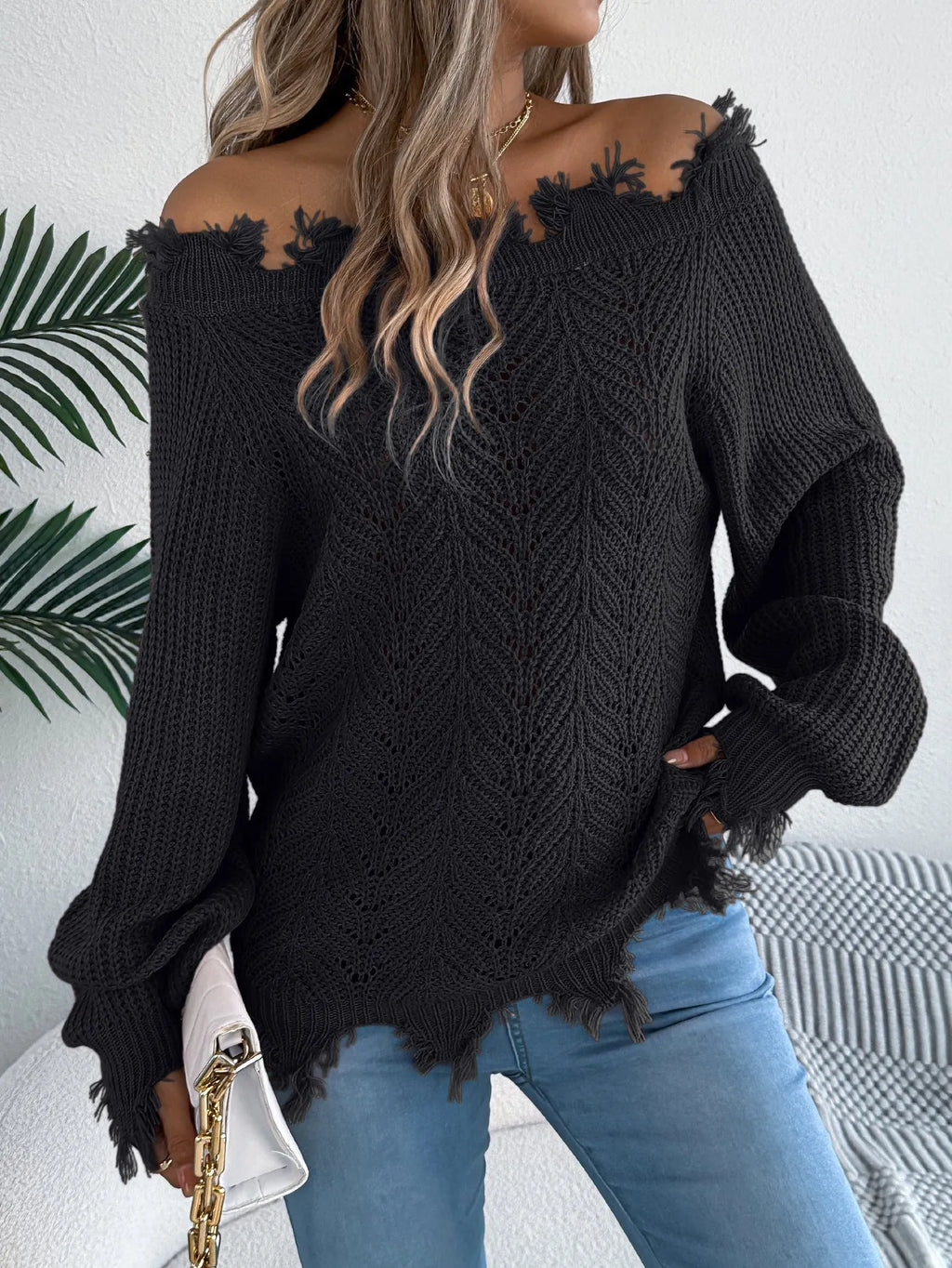 Women's white cut off-the-shoulder pullover sweater with hollow-out design and long sleeves