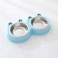 Blue stainless steel double bowl pet feeder with frog-shaped centrepiece for cat or dog food and water.