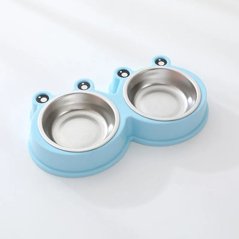 Blue stainless steel double bowl pet feeder with frog-shaped centrepiece for cat or dog food and water.