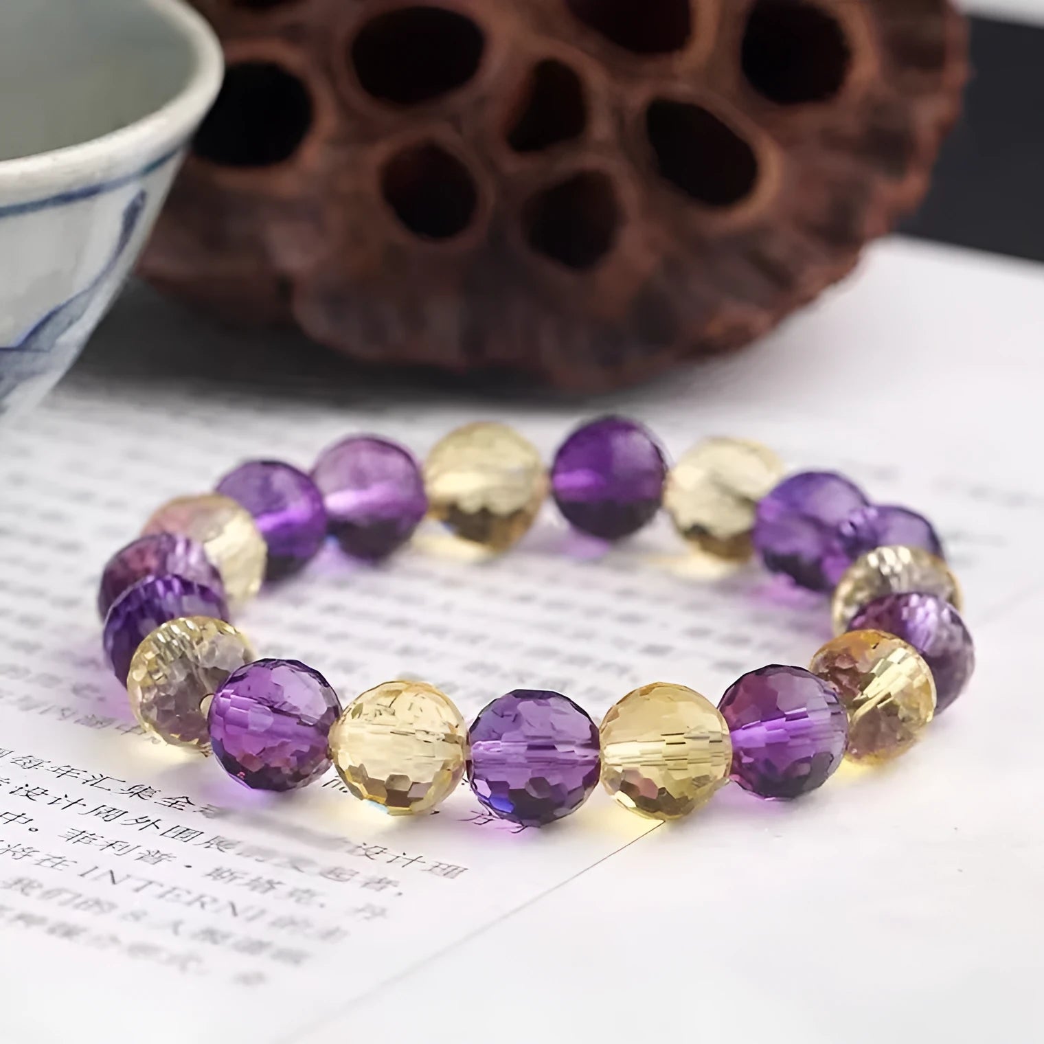 Crystal ametrine bracelet showing 128-cut faceting on beads with choice of amethyst, ametrine or citrine colours