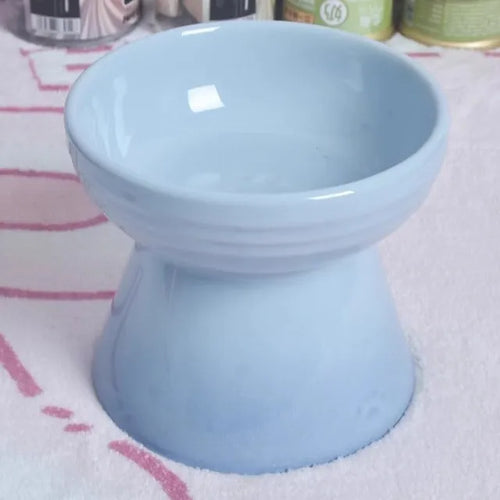 High-foot ceramic pet bowl with chin protector and anti-tumble base design