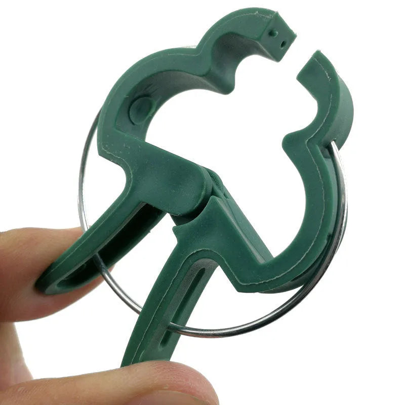 Green plastic and zinc plant support clips, showing large and small sizes for vines and tomatoes.