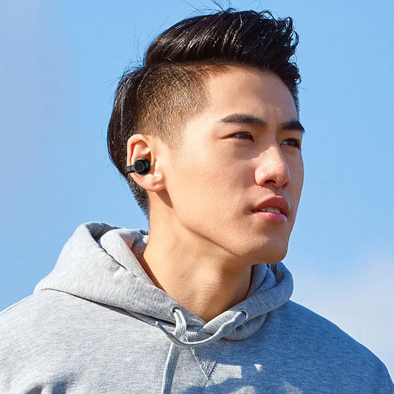 Clip-on Bluetooth earphones with bone conduction technology for wireless exercise audio