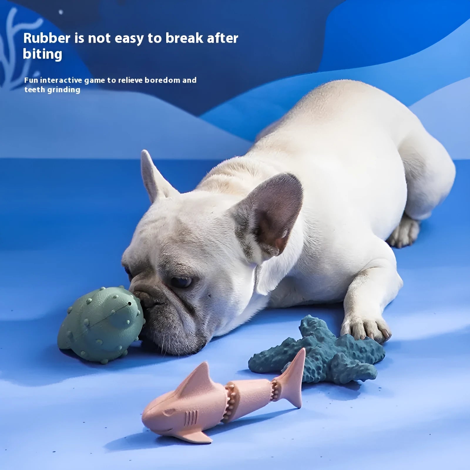Deep sea shark shaped rubber dog chew toy in blue and green marine colours.