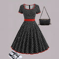 Multicolour polka dot pleated dress with a square collar and short sleeves.