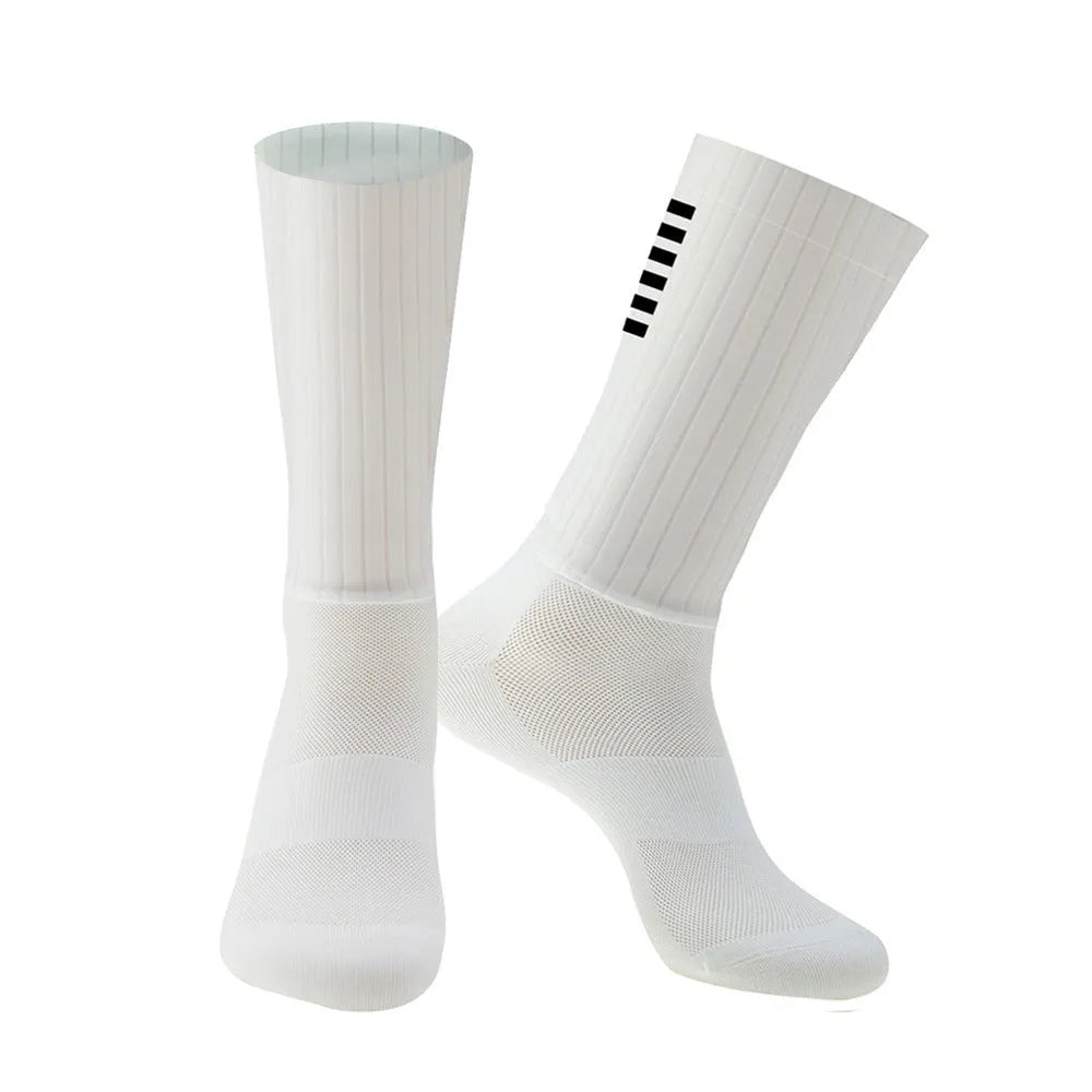 A pair of athletic cycling and running socks in a moisture-wicking fabric blend on a grey background.