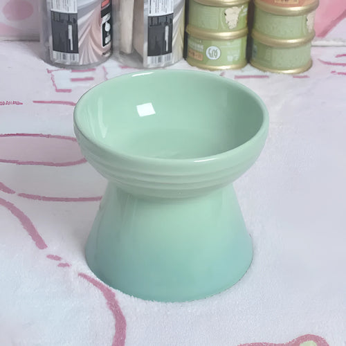 High-foot ceramic pet bowl with chin protector and anti-tumble base design
