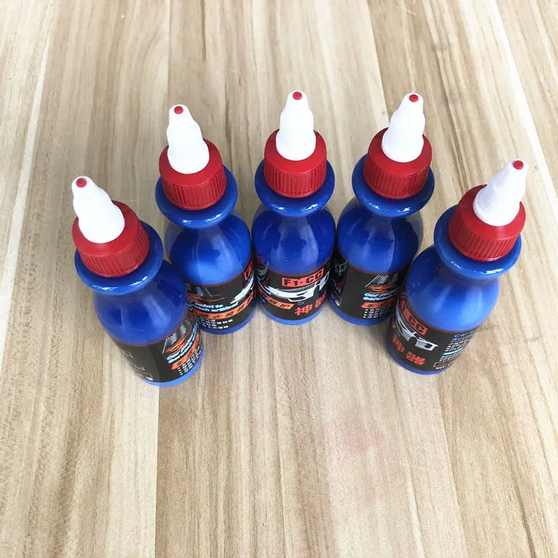 Blue car wiping tool with microfiber applicator and scratch repair agent bottle for automotive paint damage