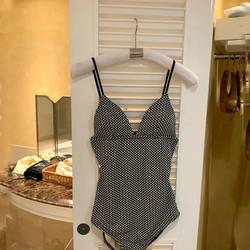 Blue one-piece swimsuit with belly cover designed for a smaller chest frame