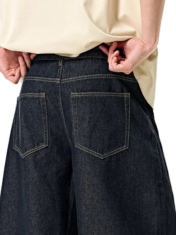 Men's wide leg denim trousers in original cow colour showing mid-waist design and relaxed fit