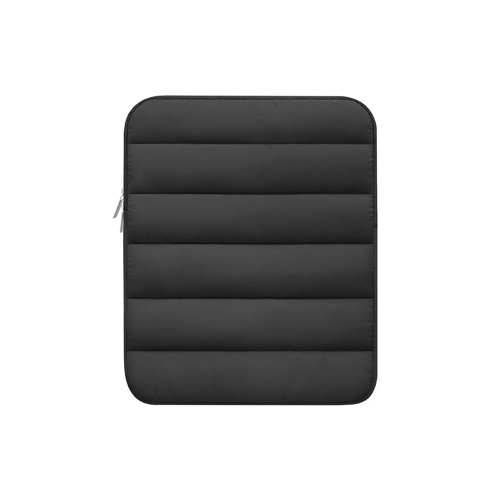 Fluffy air feeling laptop sleeve in black, open to show soft lining, next to an 11 inch tablet.