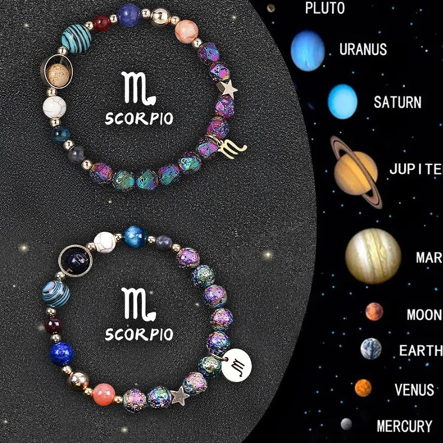 Two natural stone beaded bracelets showing Chinese zodiac sign designs on a flat surface.