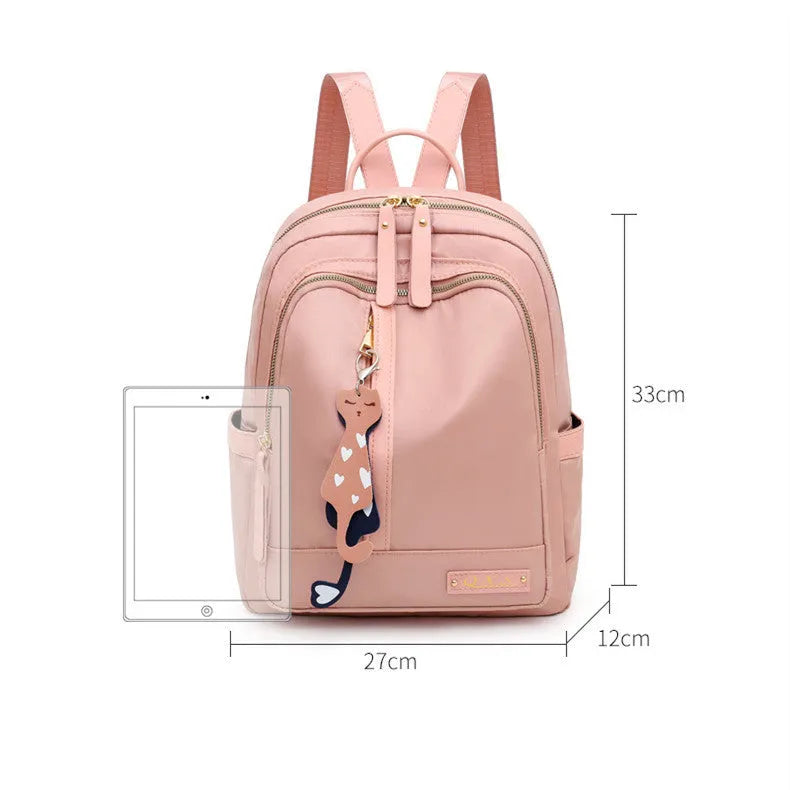 Black women's casual nylon backpack showing square vertical shape with shoulder straps and external pockets