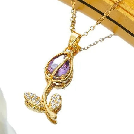Zircon tulip necklace for women in gold tone with flower pendant on adjustable O-ring chain.