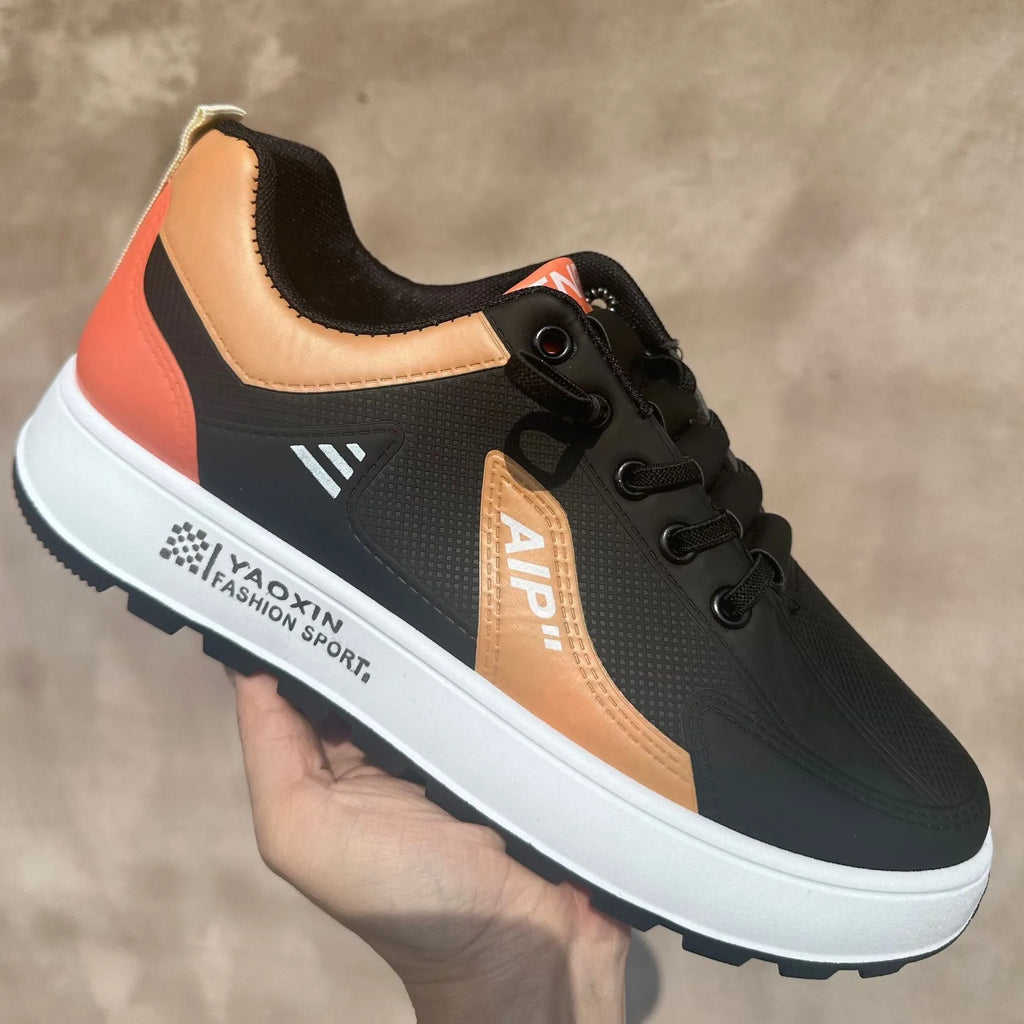 Men's casual shoes in artificial PU with round toe design available in white orange, white black, and white brown colours