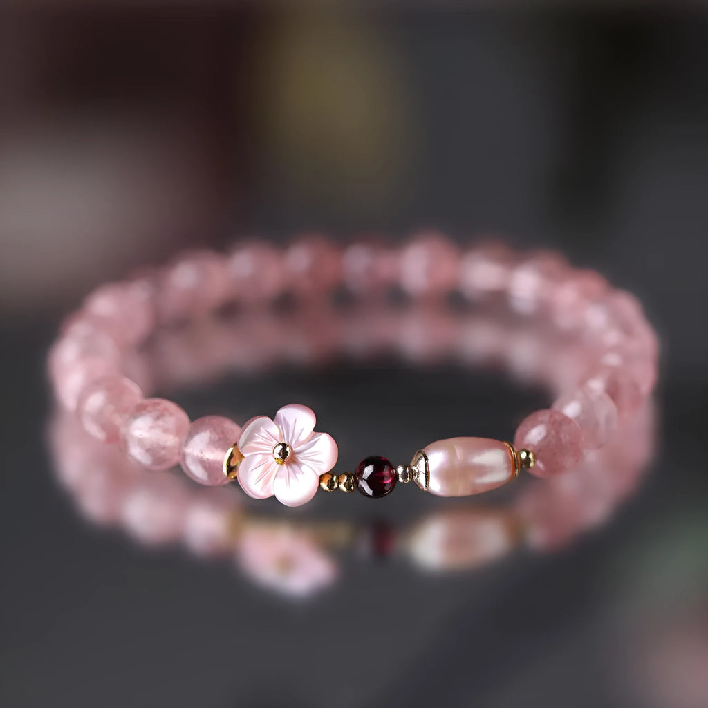 Strawberry quartz peach blossom bracelet with natural pink crystal flower beads for casual wear.