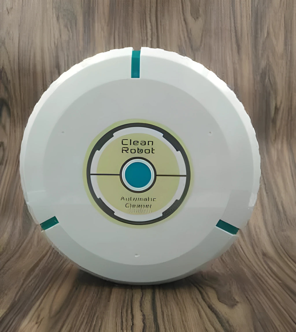 Compact black and white robot vacuum cleaner on a wooden floor