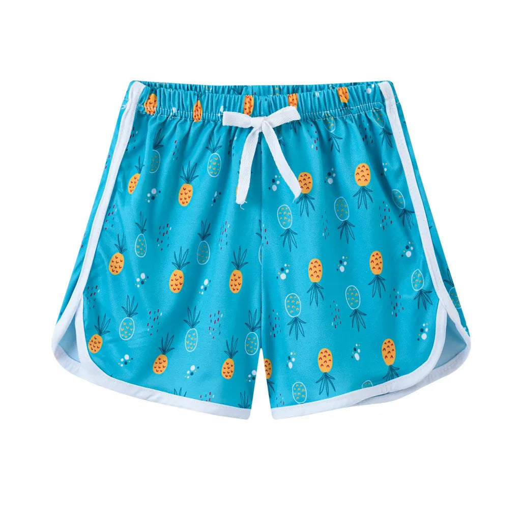 Children's polyester beach shorts in various colors and patterns including pineapple and kitten designs for sizes 100 to 140