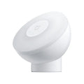 White square Mijia Night Light 2 Bluetooth bedside lamp with human body induction on wooden table