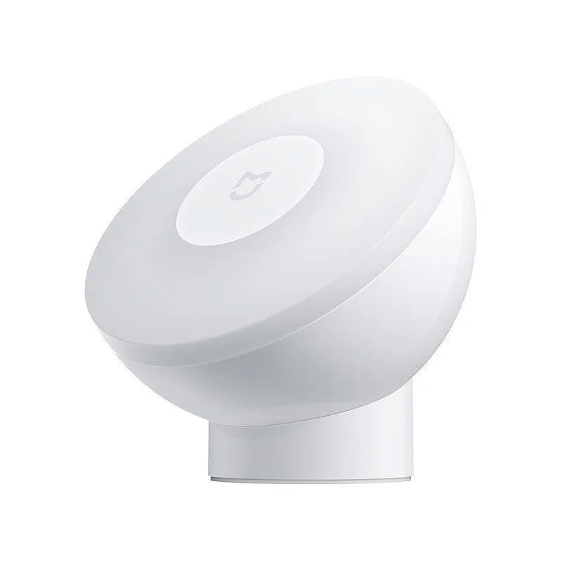 White square Mijia Night Light 2 Bluetooth bedside lamp with human body induction on wooden table