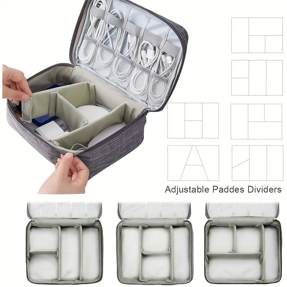 Black waterproof electronics organiser case open, showing mesh pockets, elastic loops, and removable padded dividers inside.