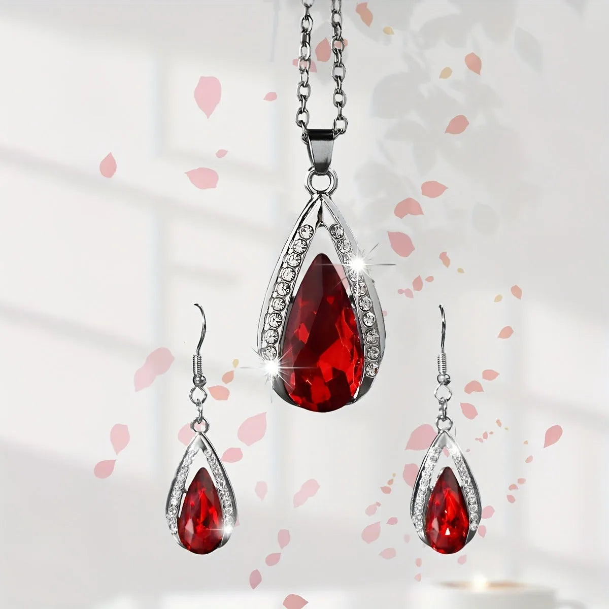 Teardrop pendant necklace and earrings suite with water droplet design in alloy