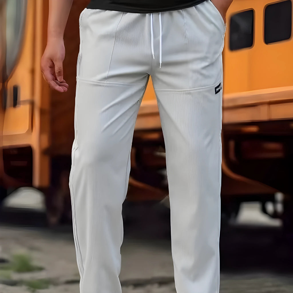 Men's polyester trousers for spring and autumn in light grey, shown in size M.