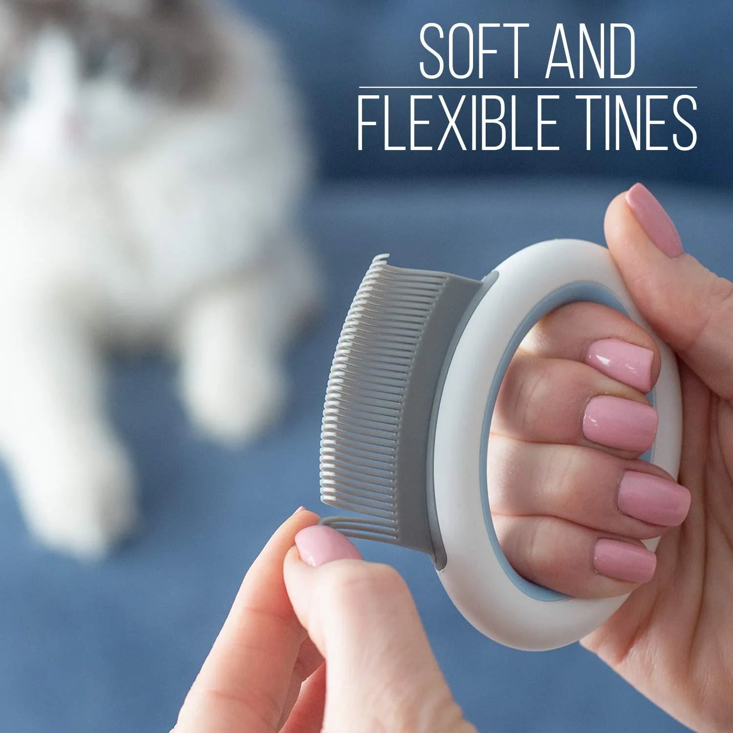 Blue pet grooming comb with ergonomic handle for deshedding and dematting cat and dog hair.