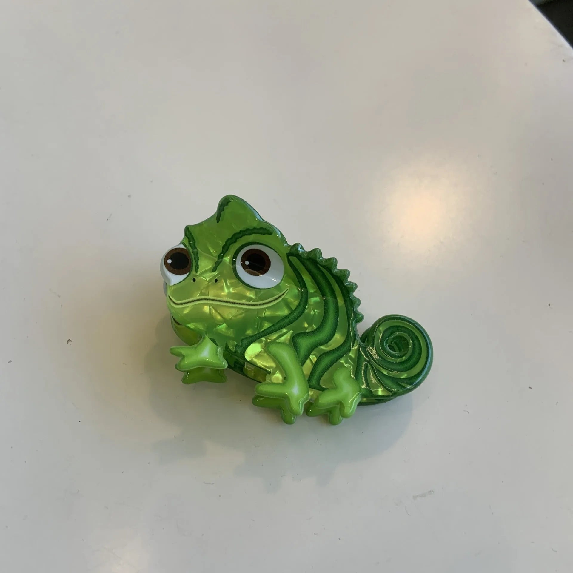 Dinosaur acrylic jaw hair clip showing grip mechanism and detailed dinosaur design in available colour options
