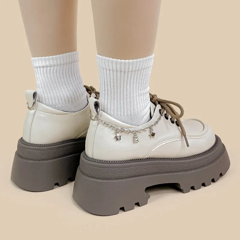 White platform leather Mary Jane shoes with round toe, lace-up front, and a thick 6-8cm chunky heel.
