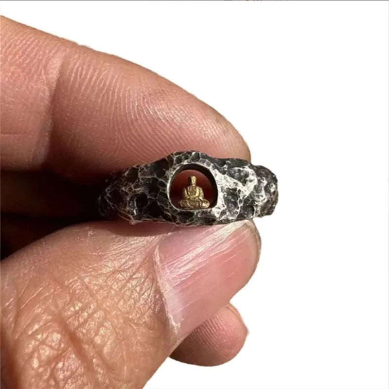 Hand-forged copper ring with grotto Buddha design and textured rock surface in size 8