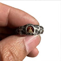 Hand-forged copper ring with grotto Buddha design and textured rock surface in size 8