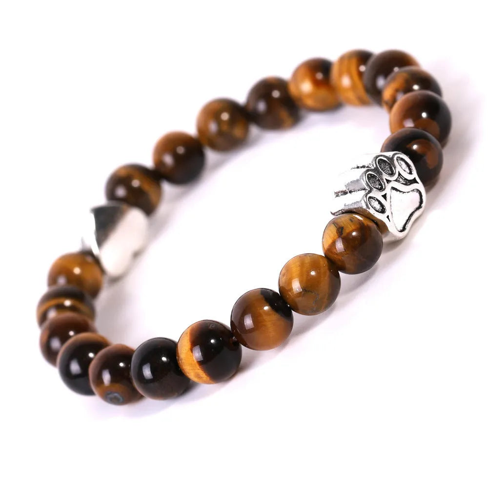 Tigereye Indian agate bracelet with geometric heart charm and dog's paw motifs on wrist