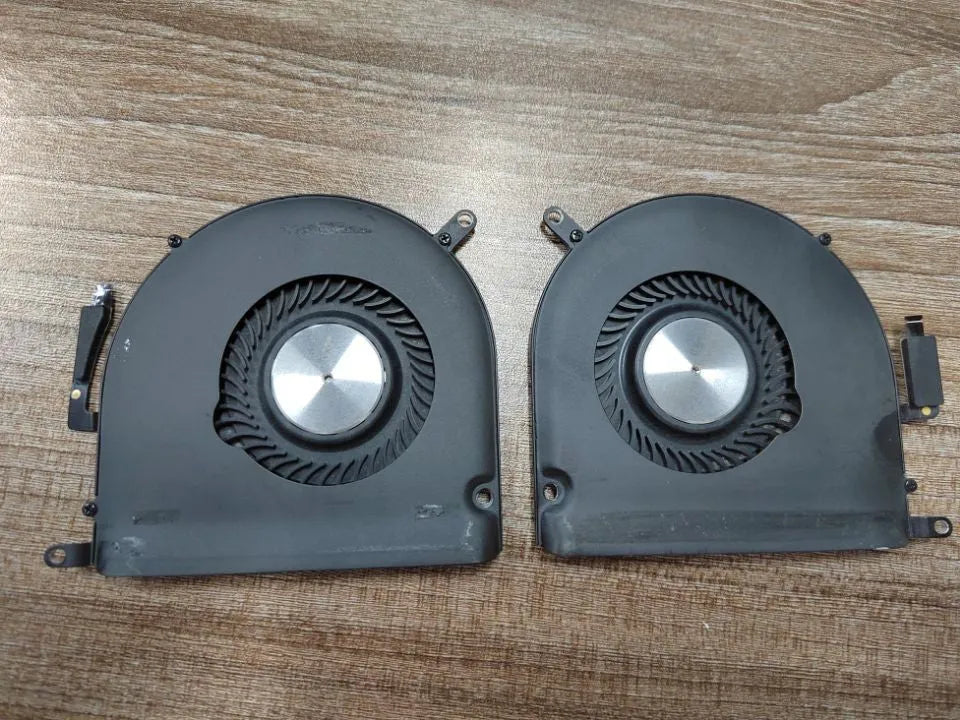 A1398 MacBook Pro laptop cooling fan replacement part on a cardboard box.