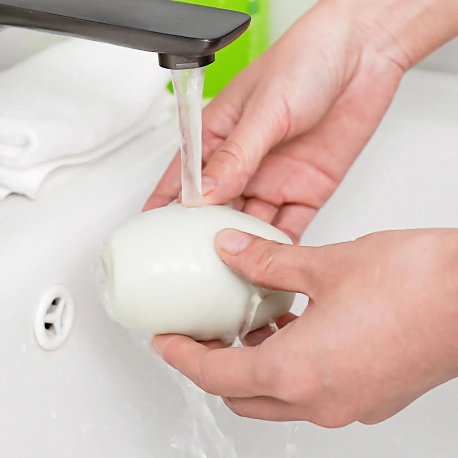 Green washable gel lint roller ball for removing pet hair from fabrics