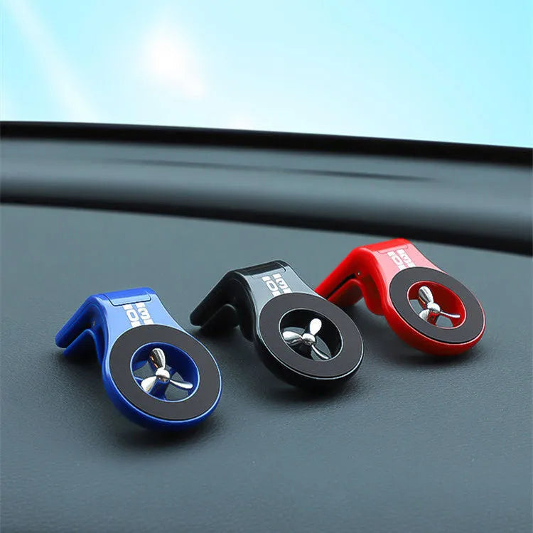 Black magnetic car air vent phone holder with adjustable angle and built-in perfume diffuser.