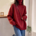 Women's thick turtleneck sweater in solid color with loose casual fit and curled pile collar detail, available in red, camel, gray, and black