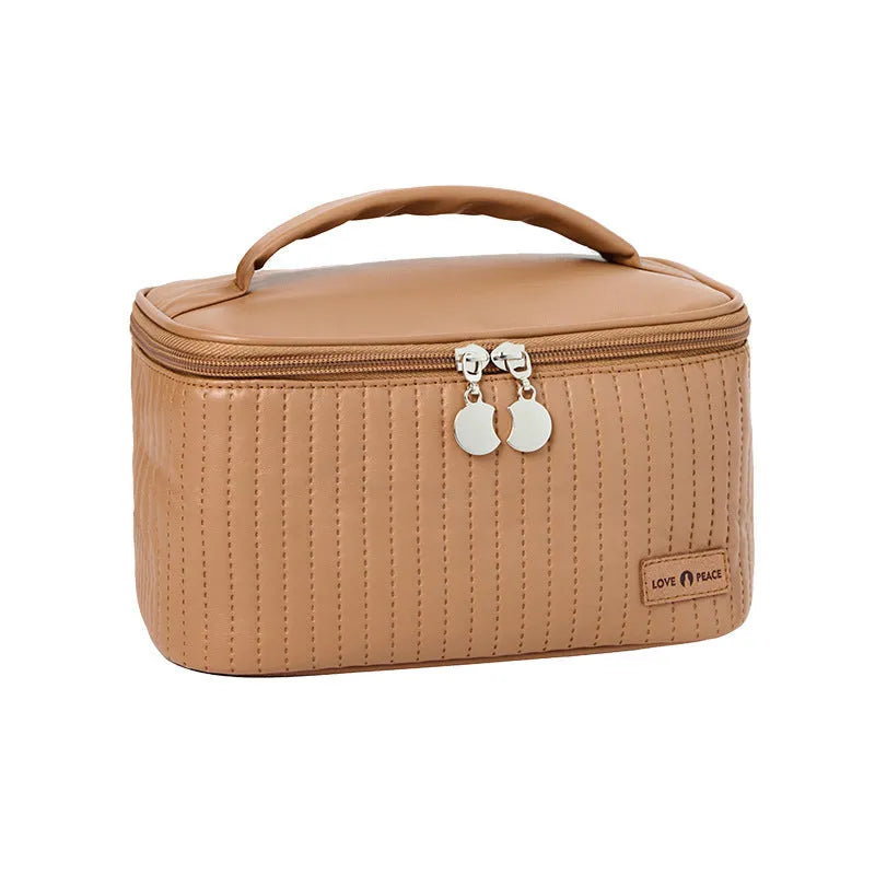 Open-top PU leather makeup bag in a choice of six solid colours including pink, beige and light blue.