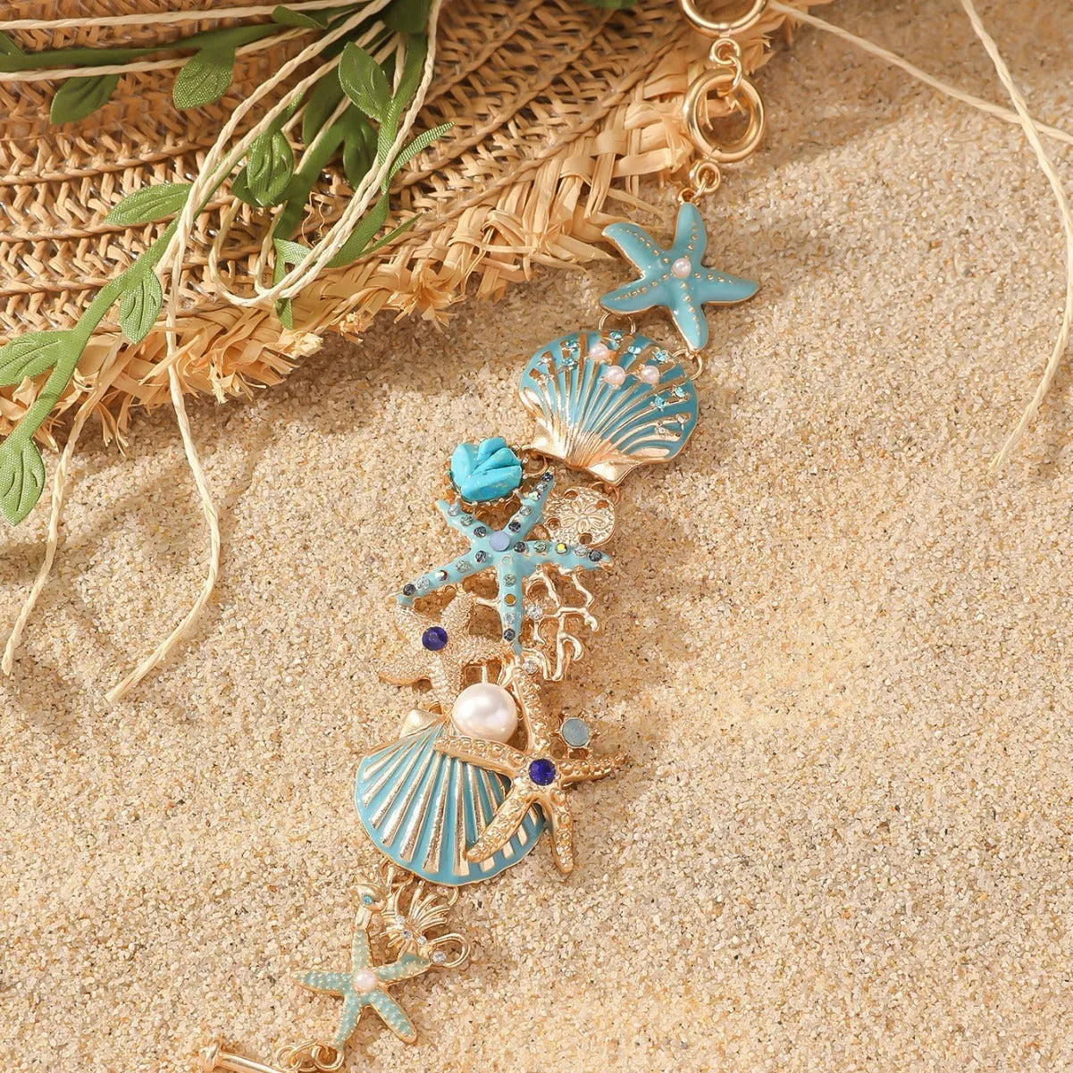 Women's alloy bracelet with boat anchor and rhinestone starfish design in turquoise, red, or blue.