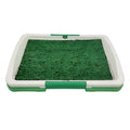Green artificial grass indoor dog toilet training tray with three-layer construction.