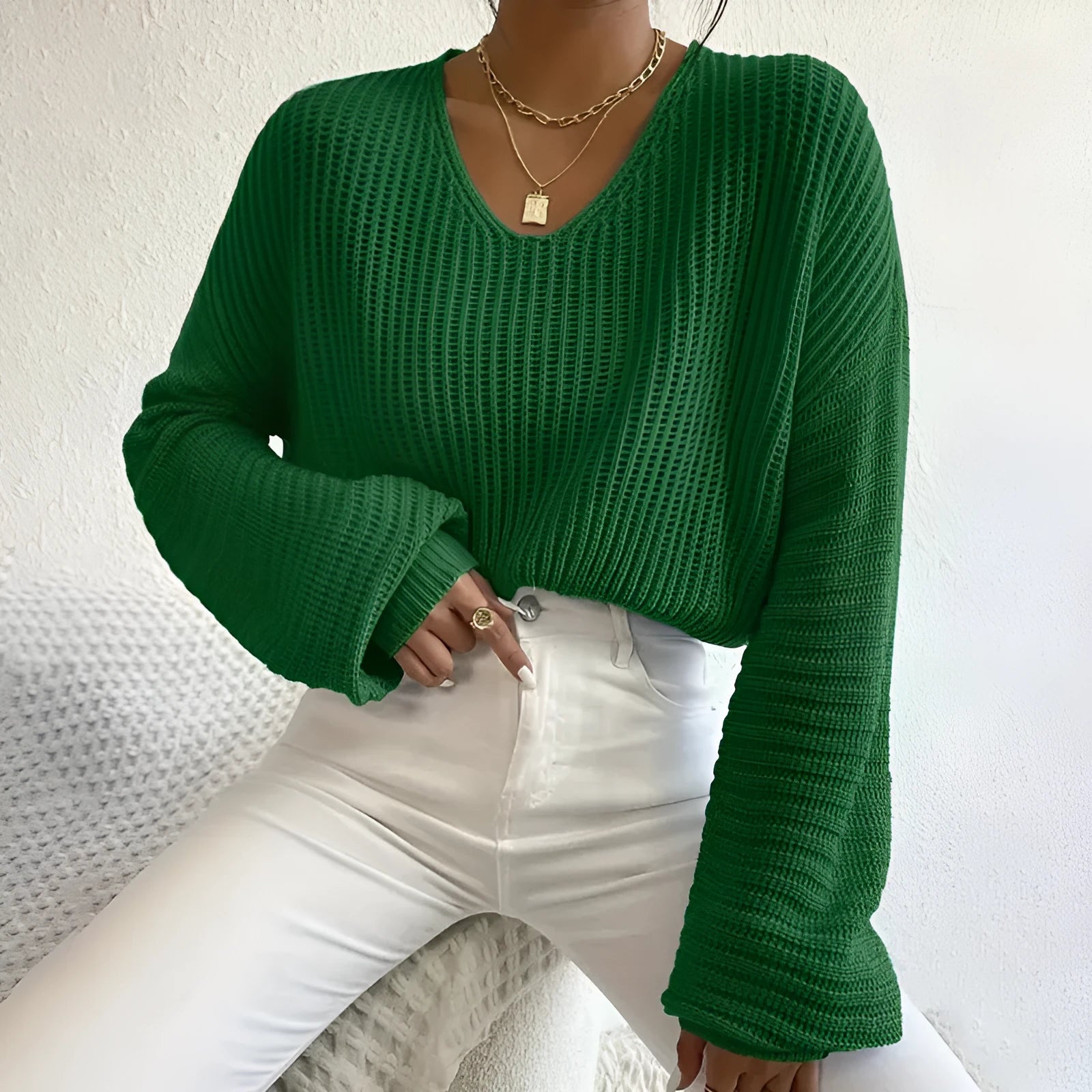 Solid colour long sleeve pullover for women in loose casual fit, shown in available colour options.