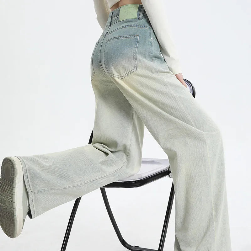 Women's gradient blue straight-leg denim trousers showing wide-leg design