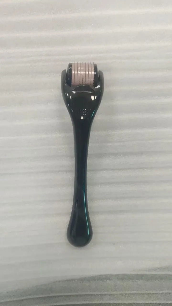Professional 540 needle dermaroller for mechanical font with coloured handle and wheel, showing sterile stainless steel needles.