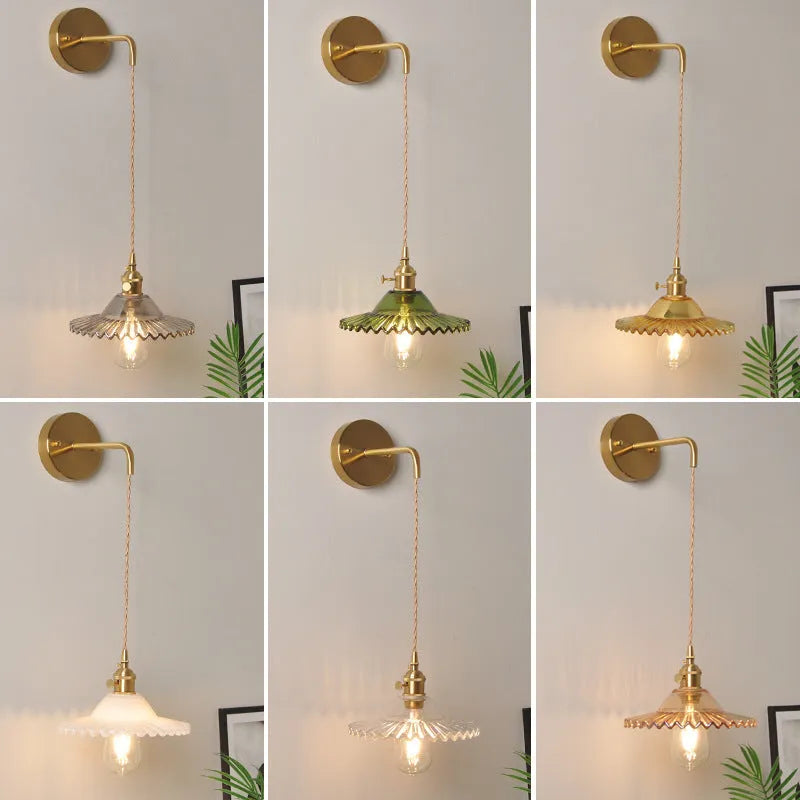 Retro brass wall lamp with lotus-shaped glass shade in choice of colours, mounted on a wall.