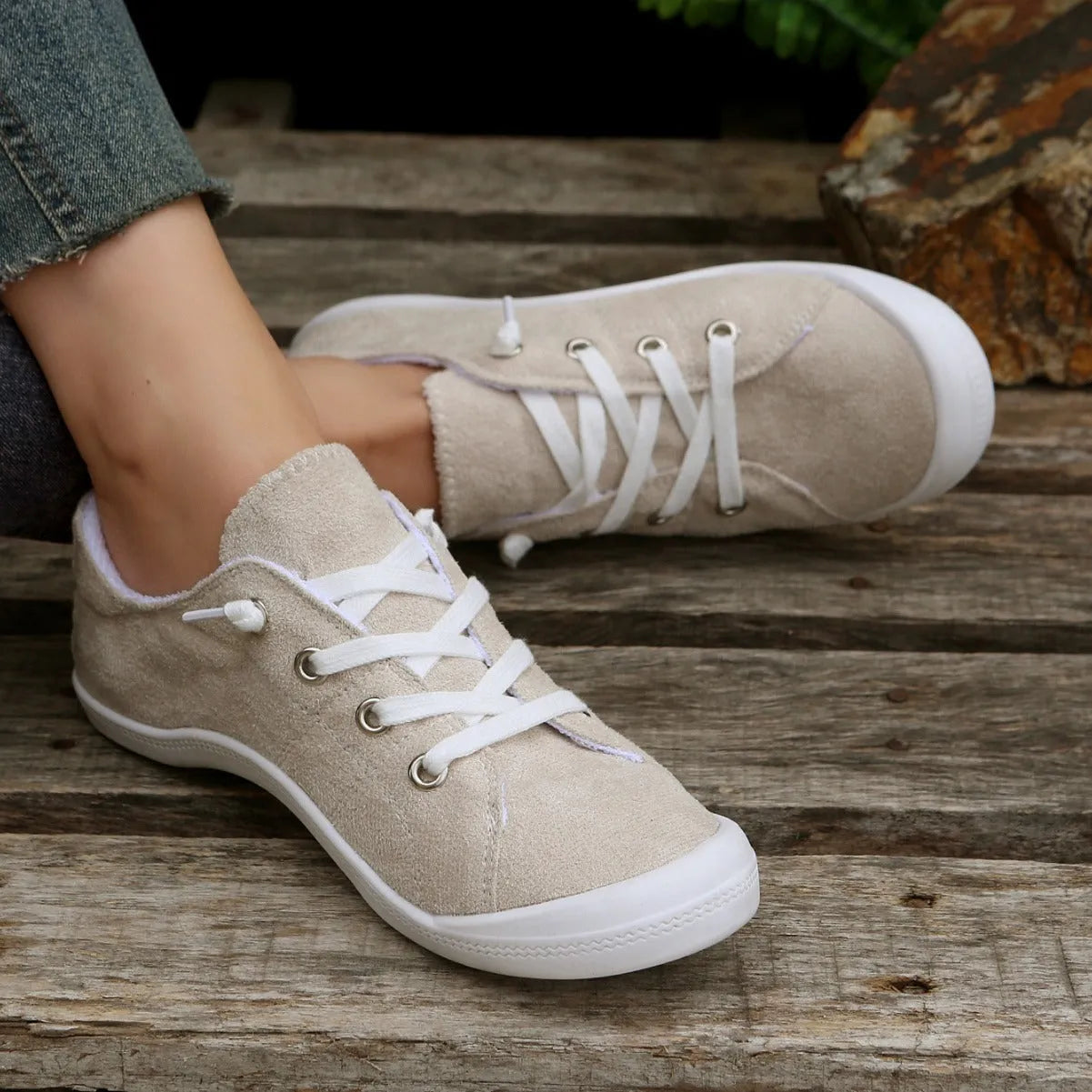 Women's creamy-white beige low-top fabric casual sneakers on a wear-resistant rubber sole.
