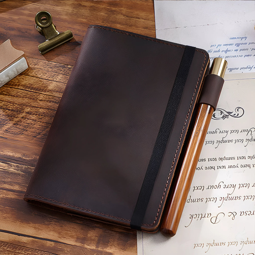 Handmade old-fashioned kraft notebook with cowhide cover, open to show 9x14cm wood-free paper