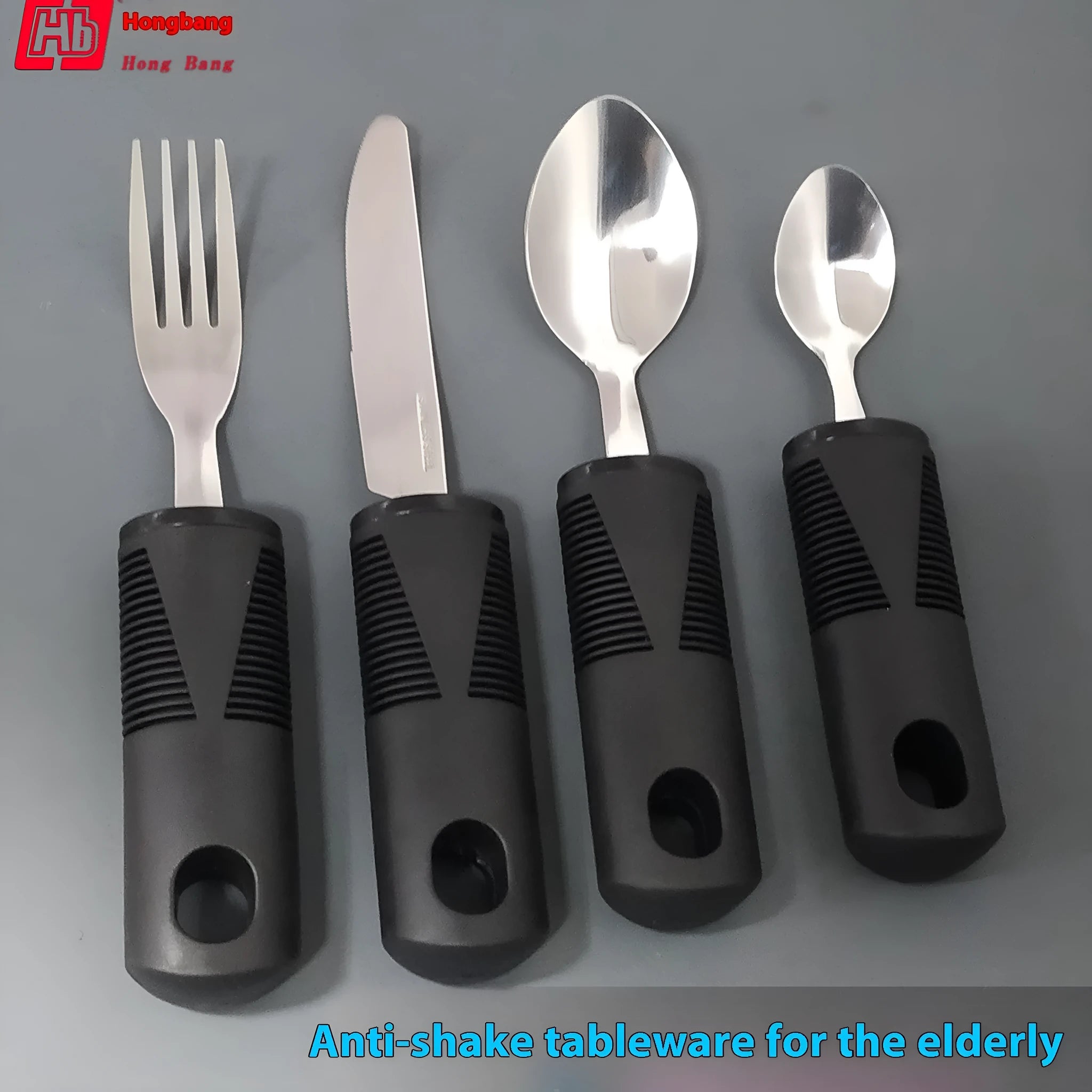 Stainless steel adaptive cutlery set with black rubber handles, showing a bendable spoon and fork.