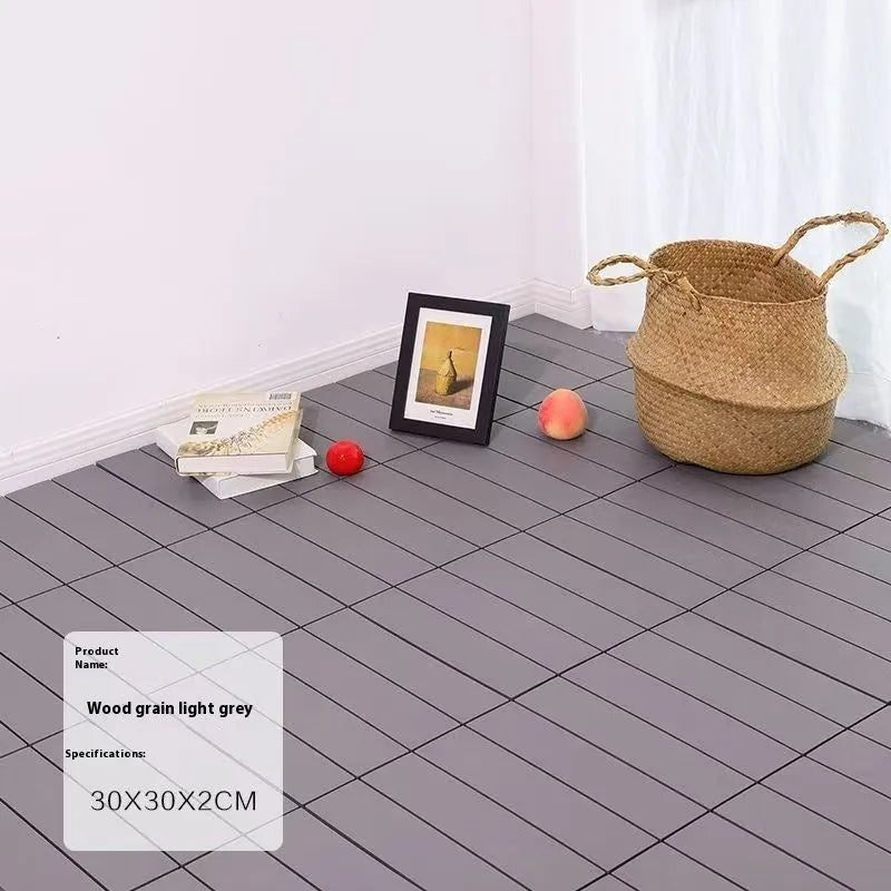 A pack of 10 square wood grain plastic floor tiles showing non-slip surface texture.